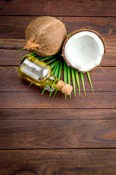 Coconut and coconut oil on wooden table